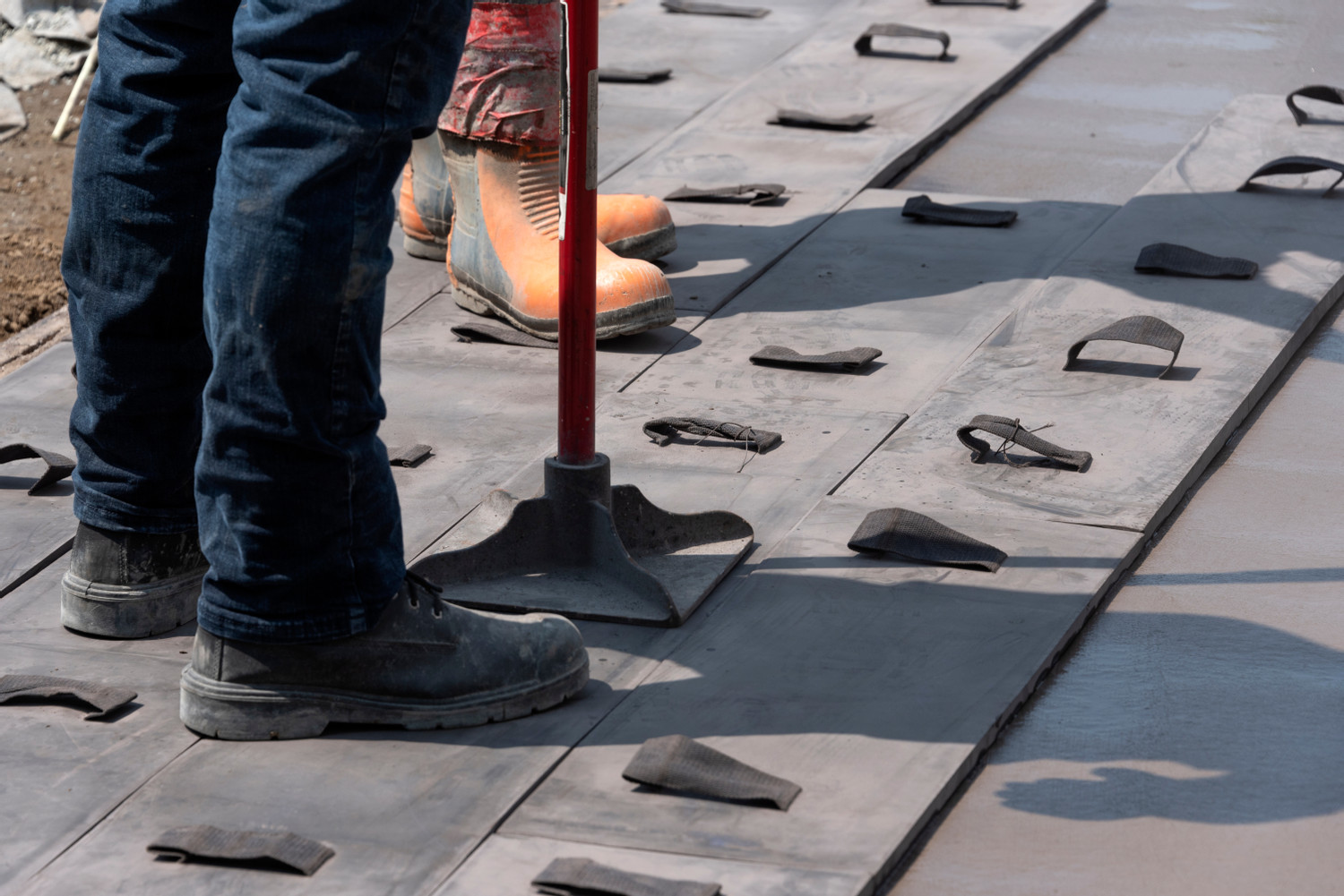 Workers,Stamping,A,Concrete,Patio,Door