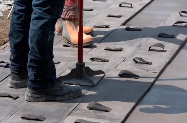 Workers,Stamping,A,Concrete,Patio,Door